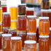 Various honey jars showcased at a Saudi market