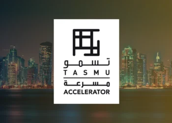 Visual banner featuring the logo of Qatar’s Ministry of Communications and Information Technology and the TASMU Accelerator over a Doha city skyline, highlighting the program’s national branding and alignment with Qatar’s Vision 2030 digital agenda.