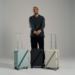 Armoir founder Martial Dahan with three premium luggage models after announcing $500K seed funding to expand in MENA and Europe.