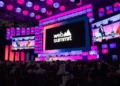Web Summit Qatar Logo on screen at DECC